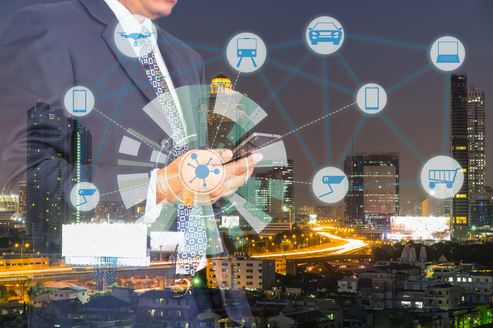 Internet of Things, Smart city and Cyber - Physical system concept. Smart things icons mesh on double exposure of business man and city traffic night background.