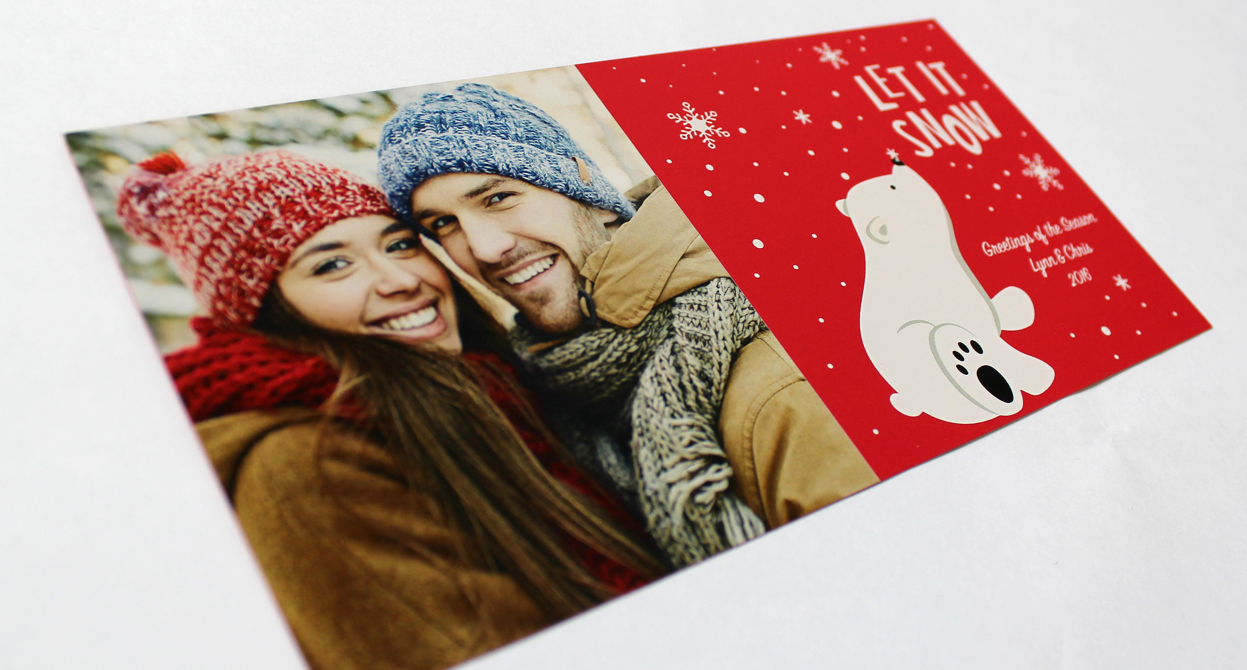 A snowflake with textured details on a postcard.