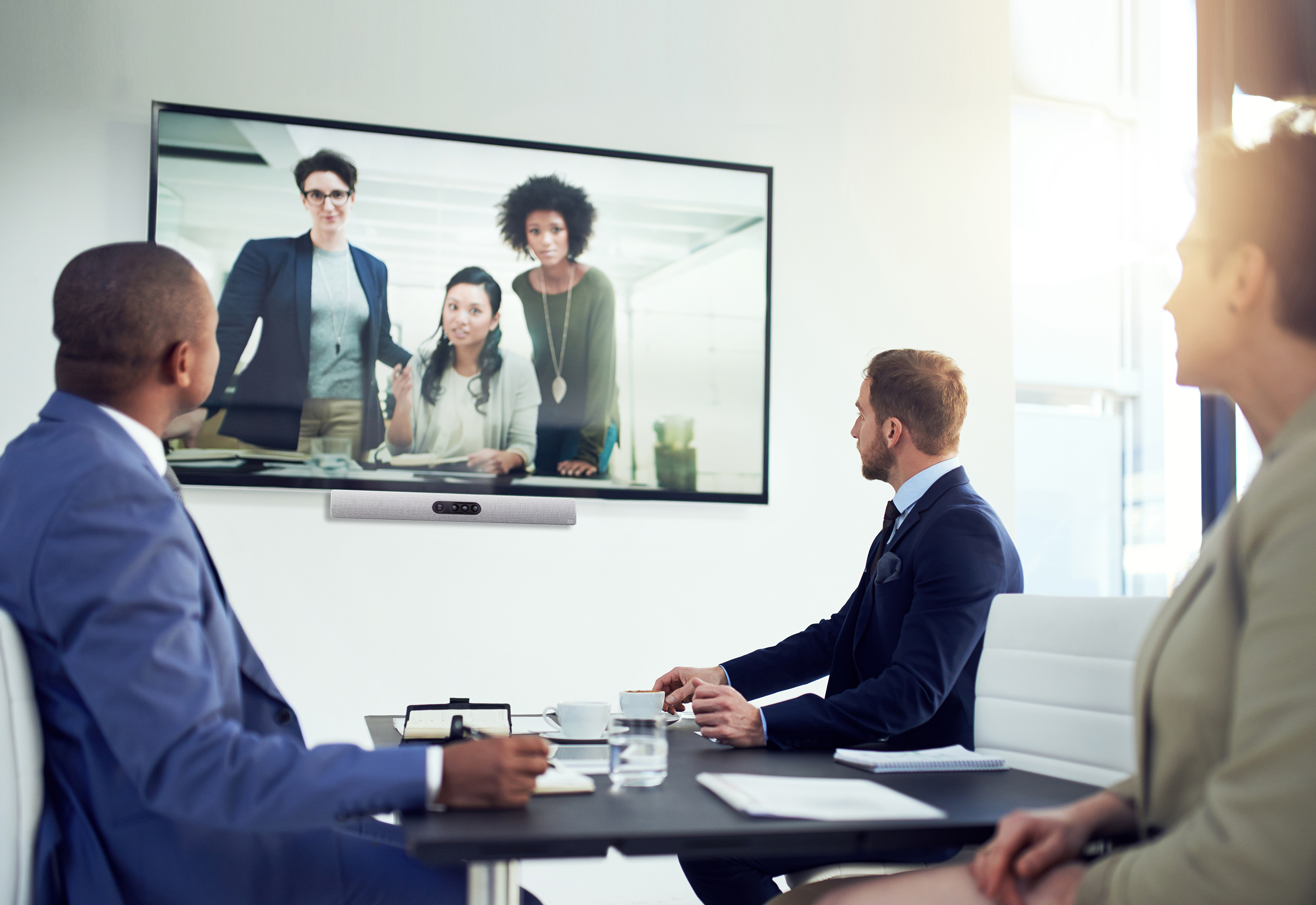 Shot of a diverse team of colleagues having a video conference in a modern office