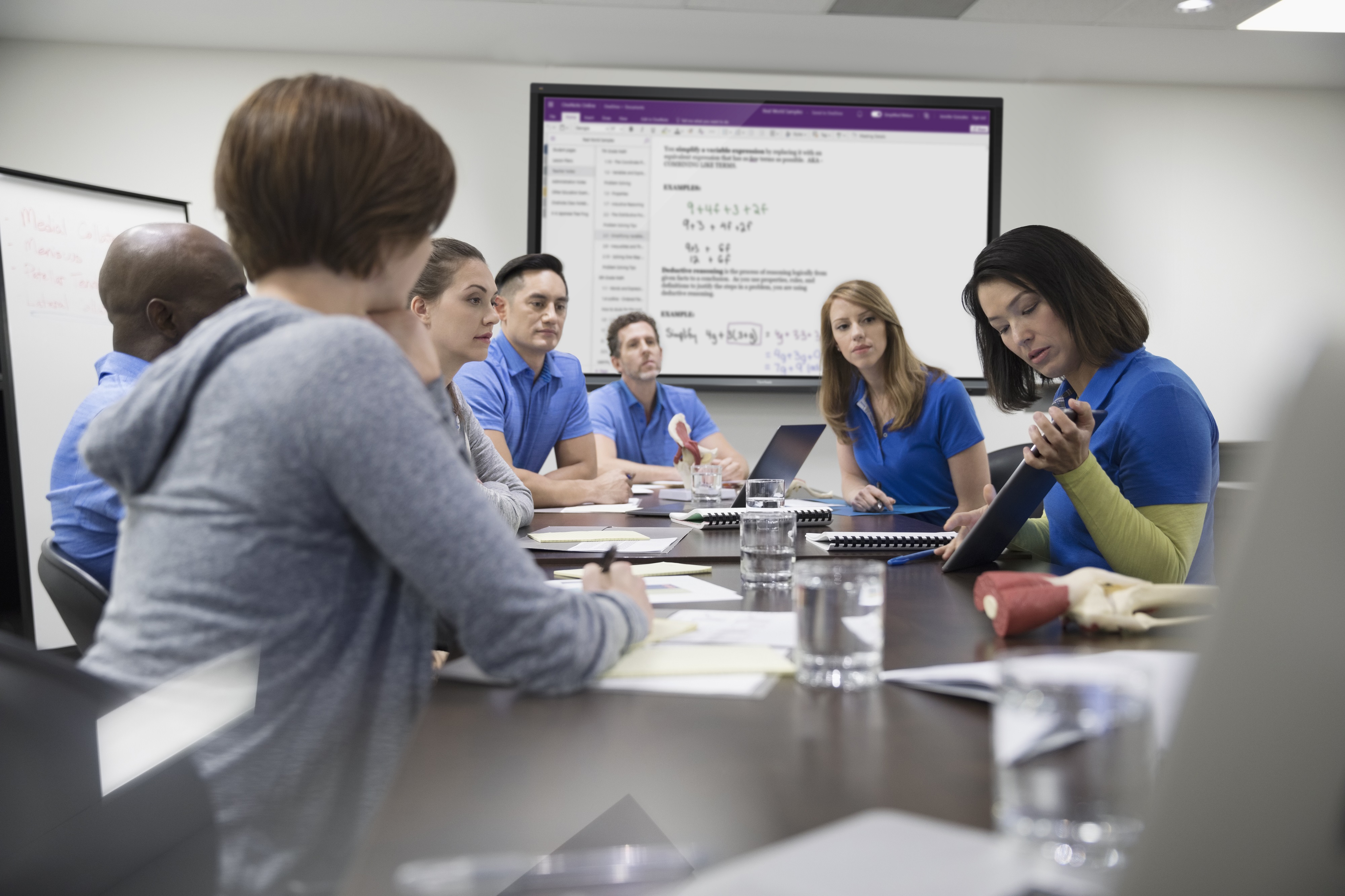 Physiotherapists training in conference room meeting