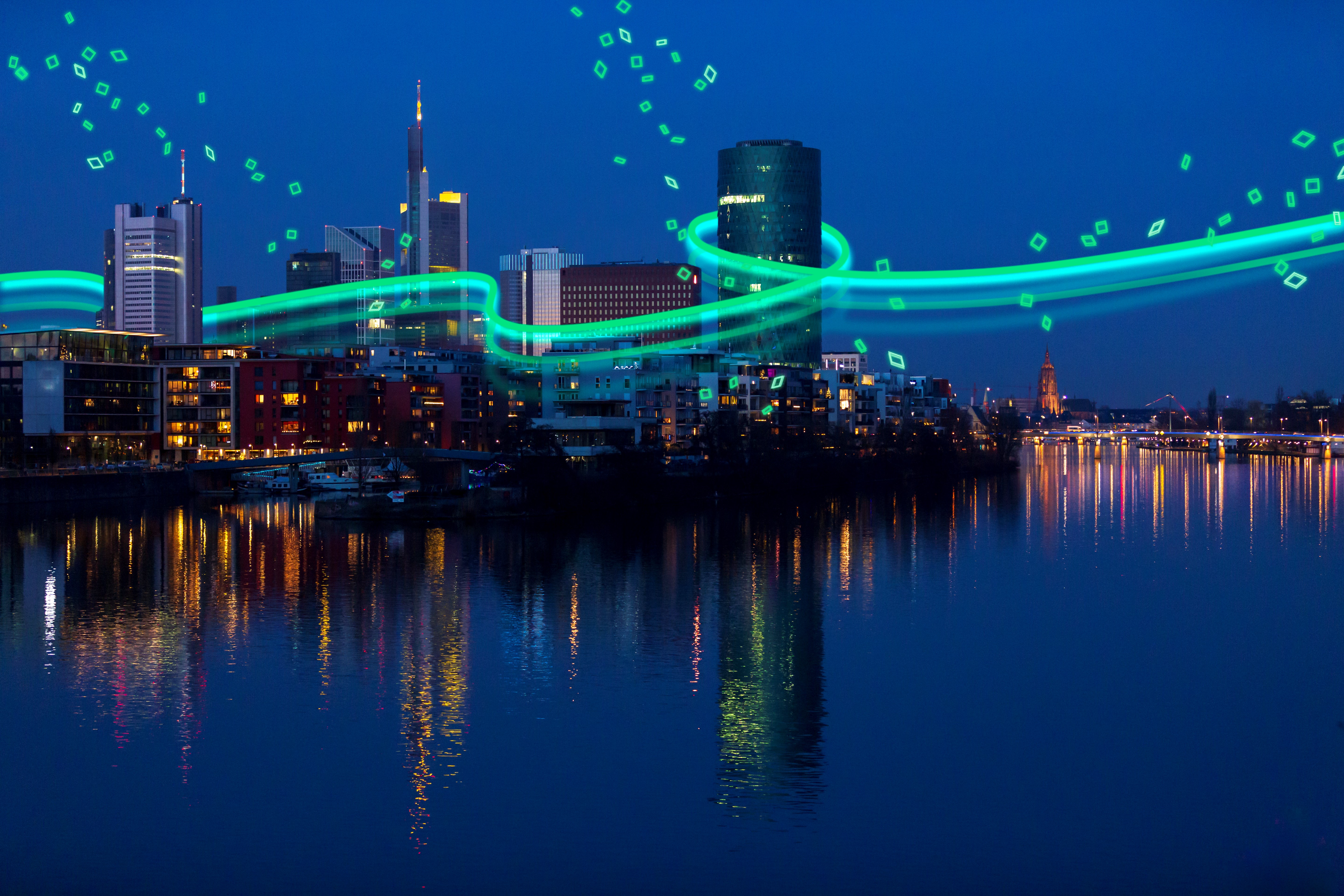 Skyline of Frankfurt / Main, Germany with river Main at dawn