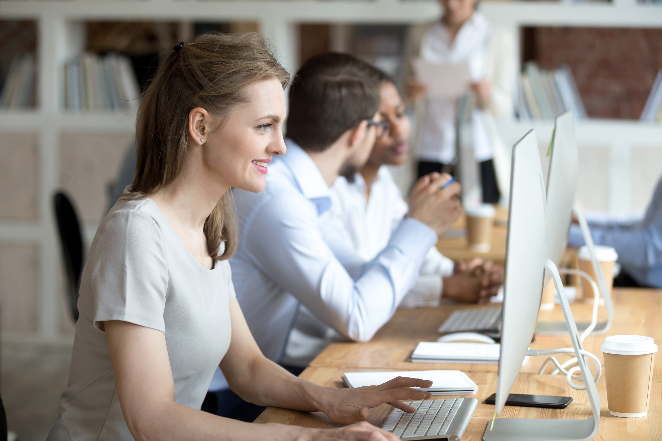 Successful manager working on pc reading positive message