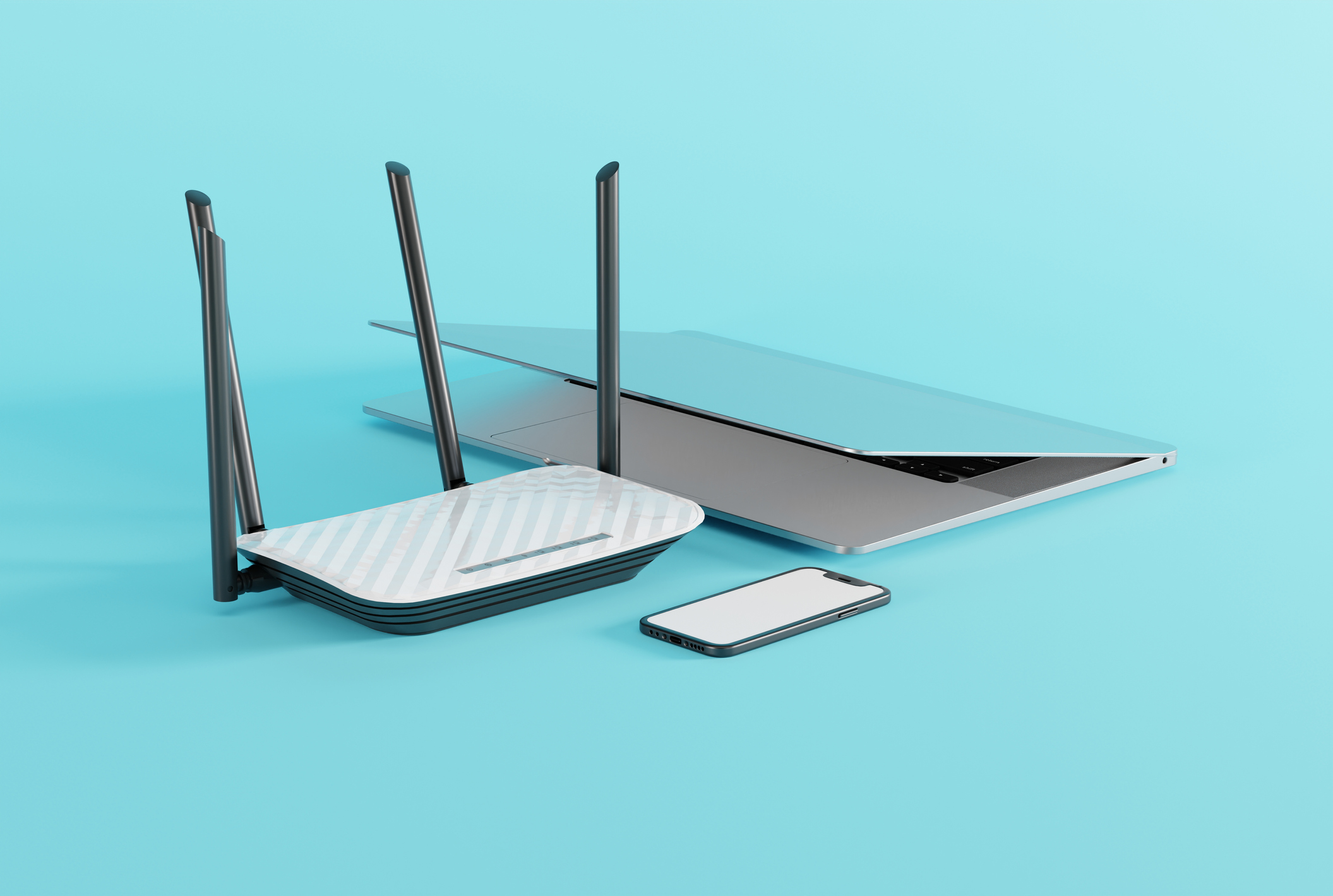 Internet router, laptop and phone on a light background.