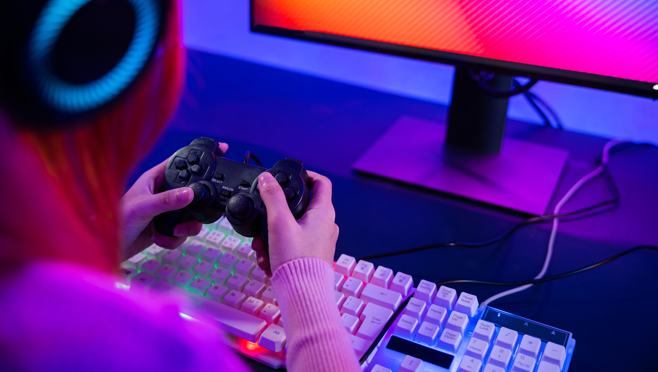 Gamer using joystick controller for virtual tournament plays online video game